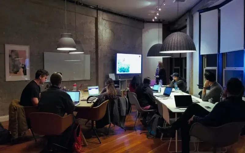 A corporate team working together in an open-plan office